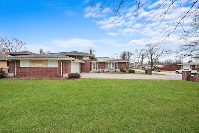 exterior space featuring a yard and a garage