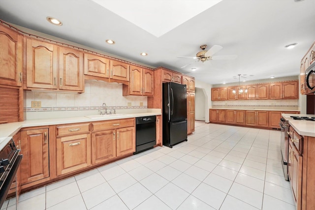 kitchen with black appliances, sink, ceiling fan, light tile patterned floors, and tasteful backsplash