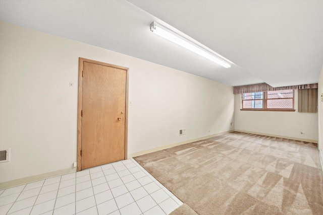 spare room with light tile patterned floors