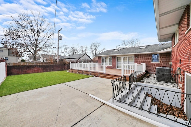 view of patio with a wooden deck and central AC unit