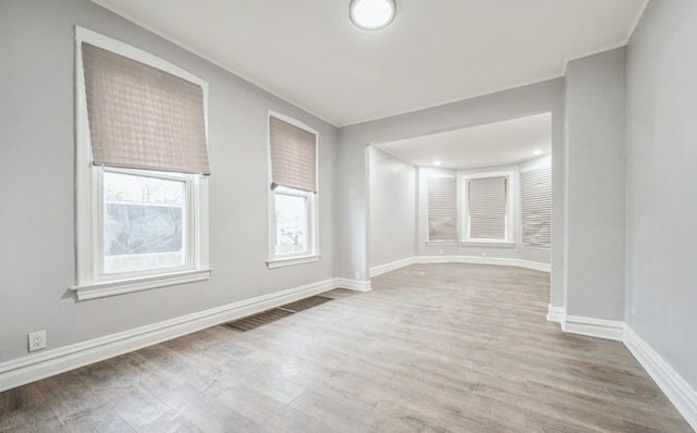 spare room featuring hardwood / wood-style floors