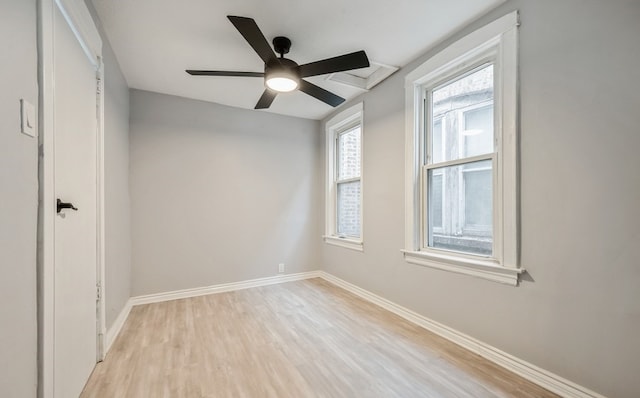 spare room featuring ceiling fan and light hardwood / wood-style floors