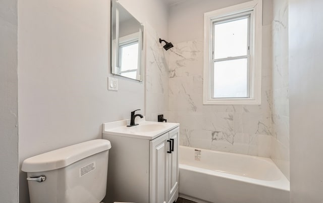 full bathroom with vanity, a healthy amount of sunlight, and toilet