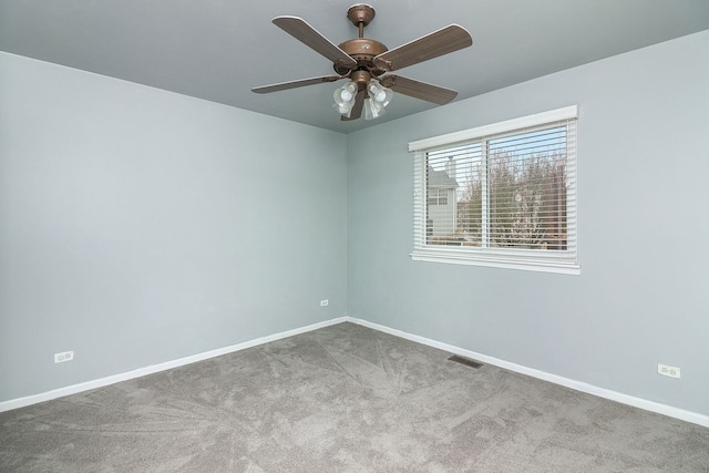 unfurnished room with ceiling fan and light colored carpet