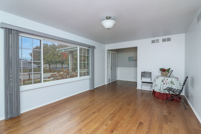 sitting room with wood-type flooring