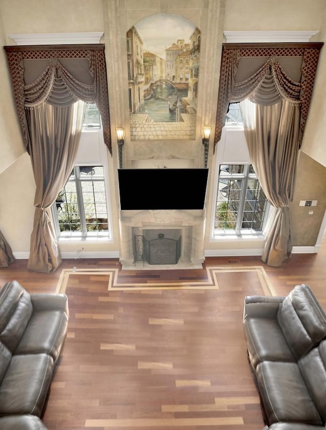 living room with baseboards and wood finished floors