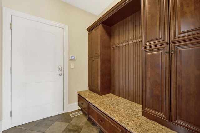 mudroom featuring baseboards and visible vents