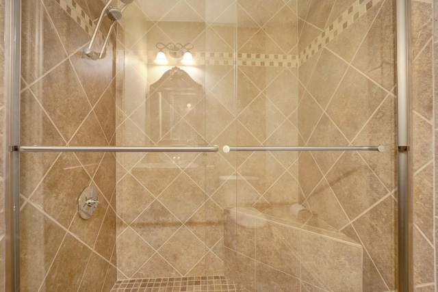 bathroom with a shower stall