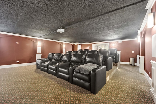 home theater room with carpet, ornamental molding, and a textured ceiling