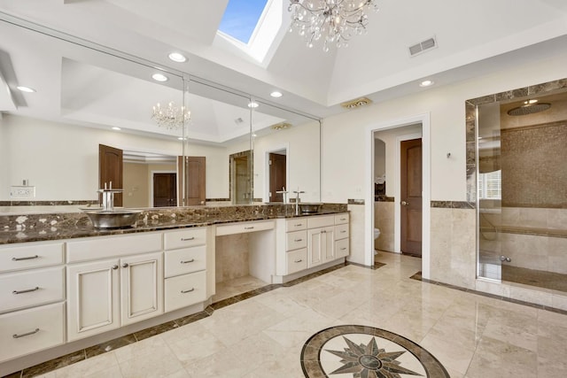 full bath featuring a stall shower, vanity, visible vents, and recessed lighting