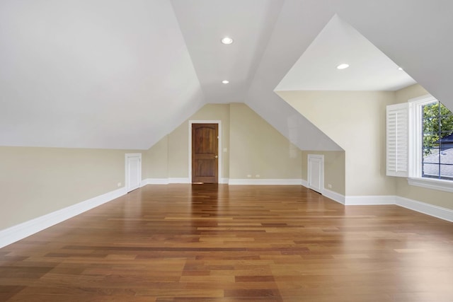 bonus room featuring vaulted ceiling, recessed lighting, wood finished floors, and baseboards