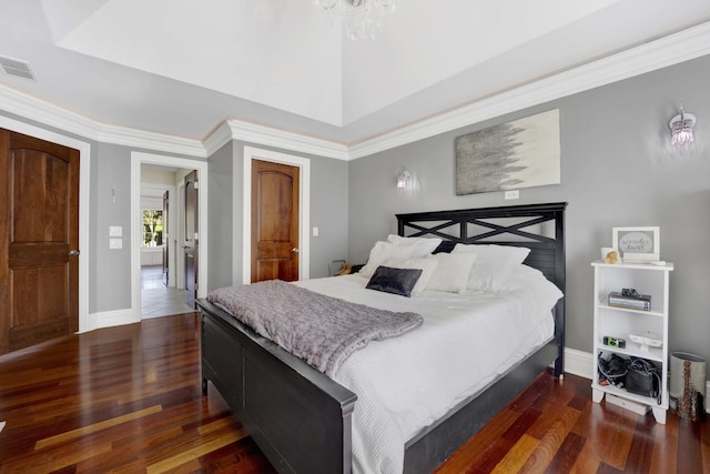 bedroom featuring dark wood-style flooring, visible vents, and baseboards