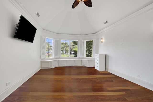 spare room featuring lofted ceiling, visible vents, and wood finished floors