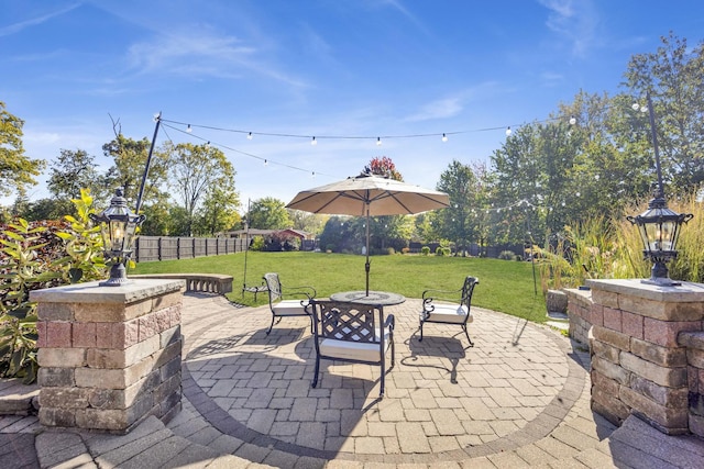 view of patio featuring fence