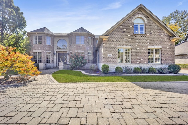 view of front of home with brick siding