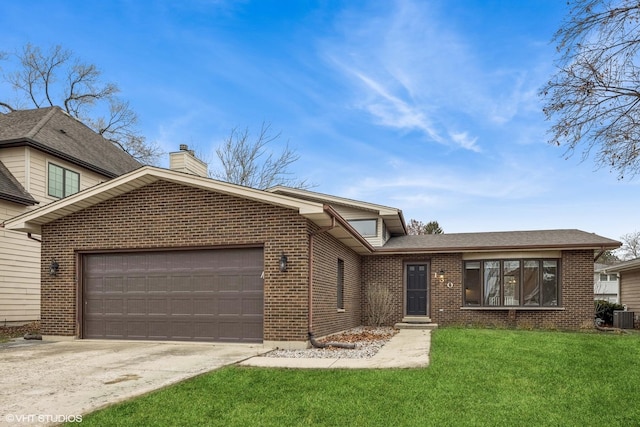 view of front of house featuring central AC unit, a garage, and a front lawn