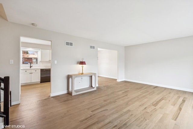 living room with light hardwood / wood-style flooring