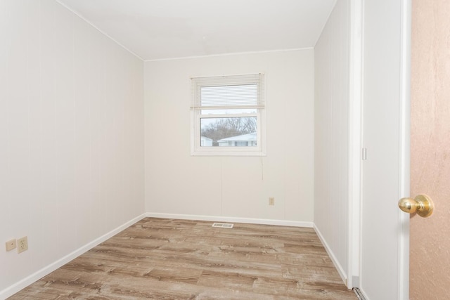 spare room with light hardwood / wood-style floors