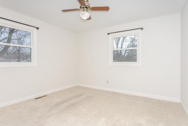 unfurnished room with carpet floors and ceiling fan