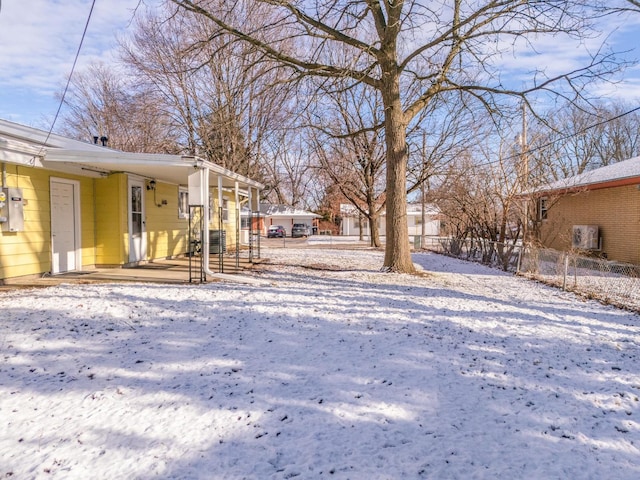 view of yard layered in snow