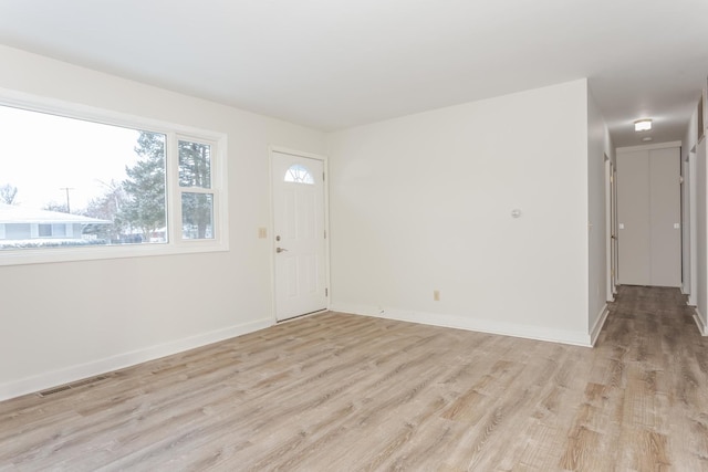 spare room featuring light hardwood / wood-style flooring