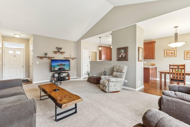 living room with carpet and lofted ceiling