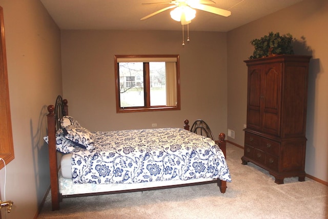 bedroom featuring ceiling fan and light colored carpet