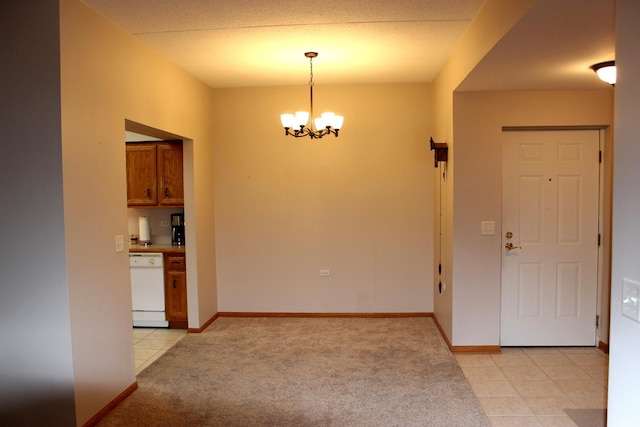 unfurnished dining area featuring light carpet and an inviting chandelier