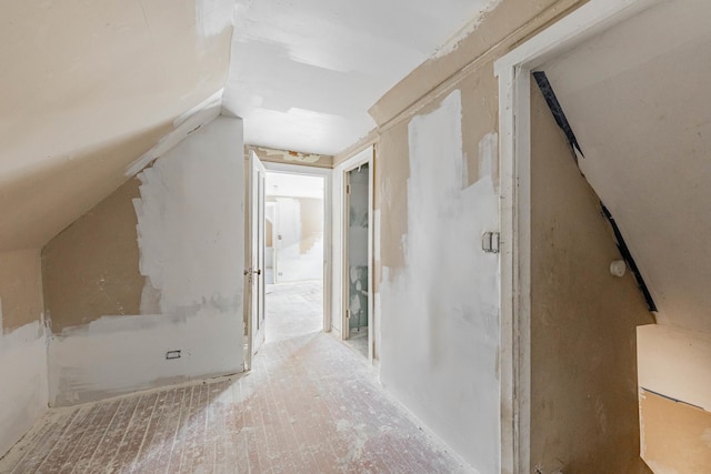 corridor with lofted ceiling