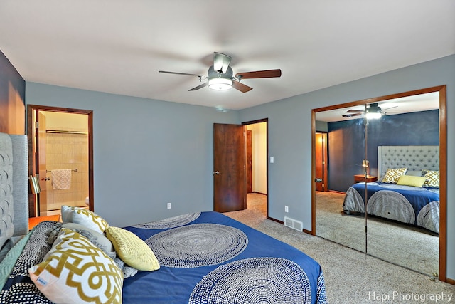 carpeted bedroom featuring ensuite bathroom and ceiling fan