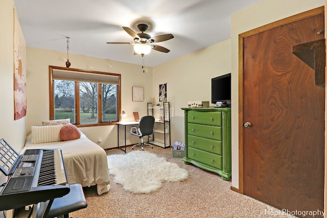 carpeted bedroom featuring ceiling fan