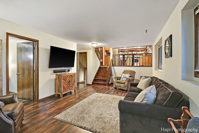 living room featuring dark wood-type flooring