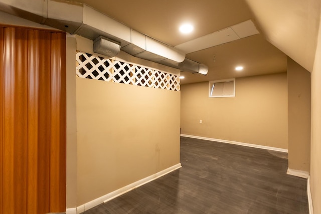 finished basement with dark wood-style floors, recessed lighting, and baseboards