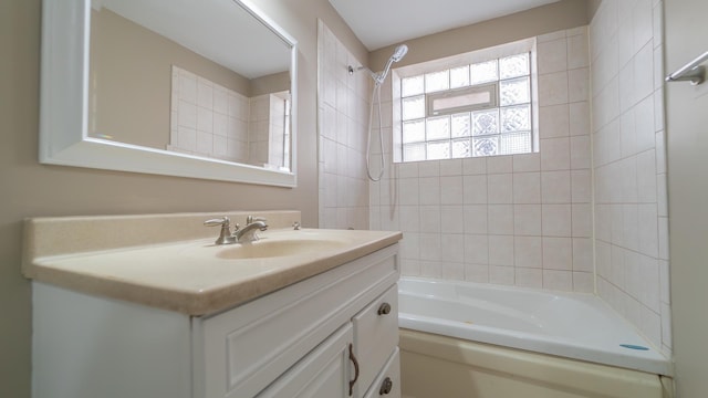 bathroom featuring vanity and tiled shower / bath combo