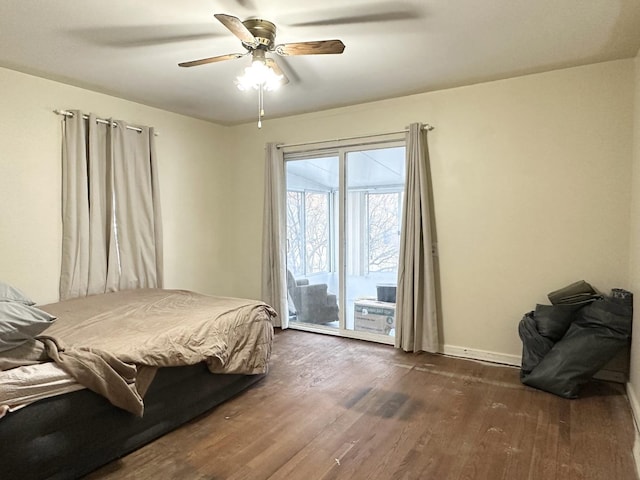 bedroom featuring access to outside, dark wood-type flooring, and ceiling fan