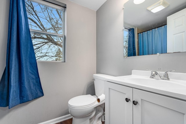 bathroom with vanity and toilet