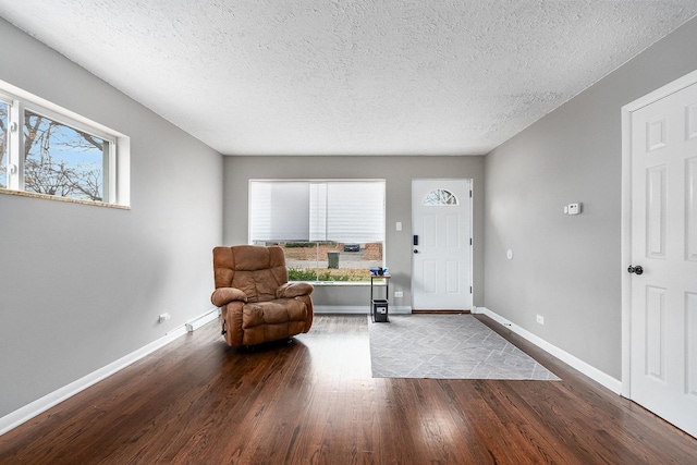 entryway featuring light hardwood / wood-style flooring and a textured ceiling