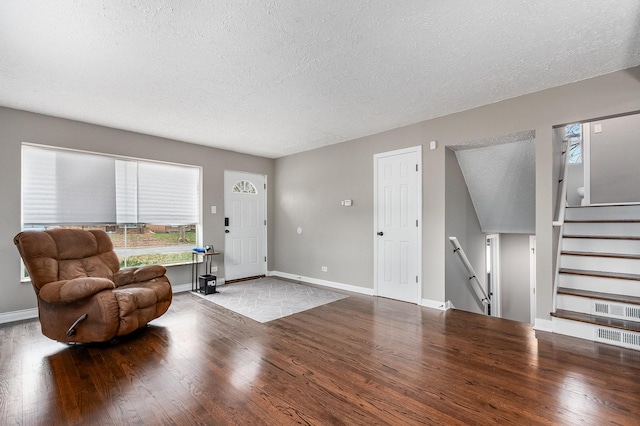 entryway featuring light hardwood / wood-style floors and a textured ceiling