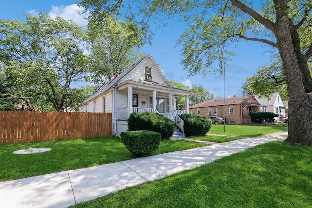 bungalow-style house featuring a porch and a front yard