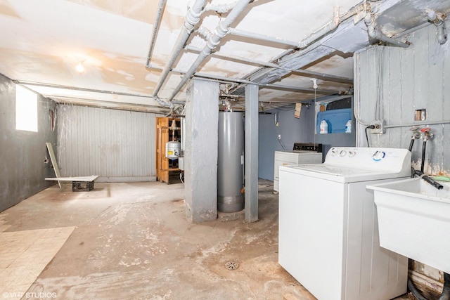 basement featuring gas water heater and sink