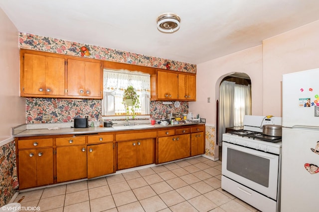 kitchen with white appliances and sink