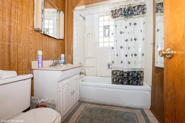 full bathroom featuring a wealth of natural light and wooden walls