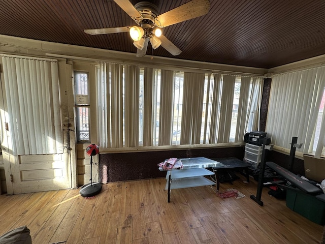 sunroom / solarium featuring ceiling fan