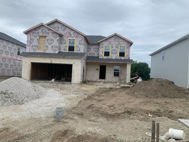 property in mid-construction featuring a garage