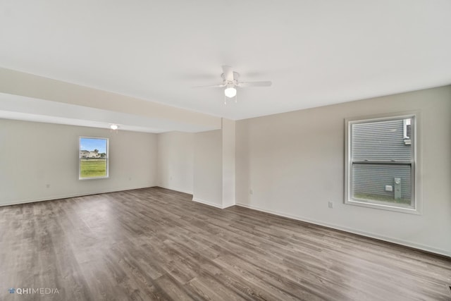 unfurnished room with wood-type flooring and ceiling fan