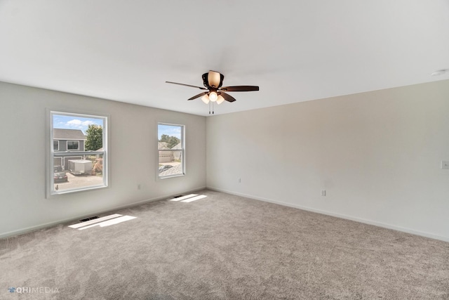 carpeted empty room with ceiling fan