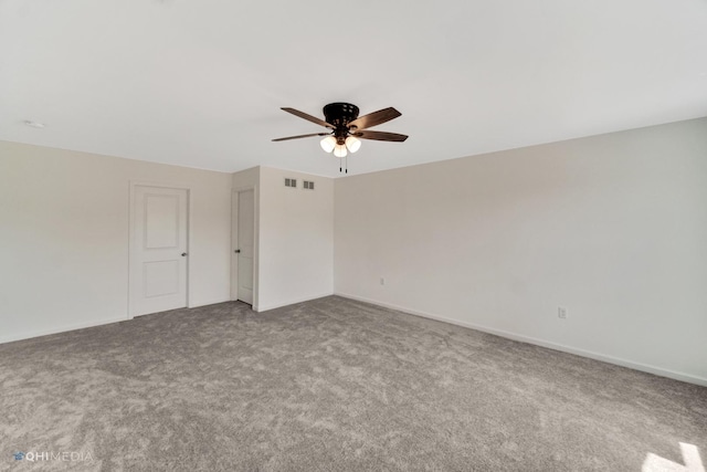 unfurnished room featuring ceiling fan and carpet floors