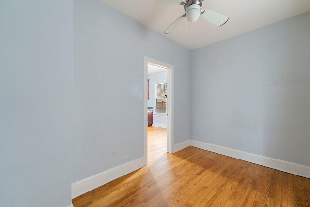 3022 N Hamilton Ave, Chicago, IL 60618 - spare room featuring baseboards, a ceiling fan, and light wood-style floors