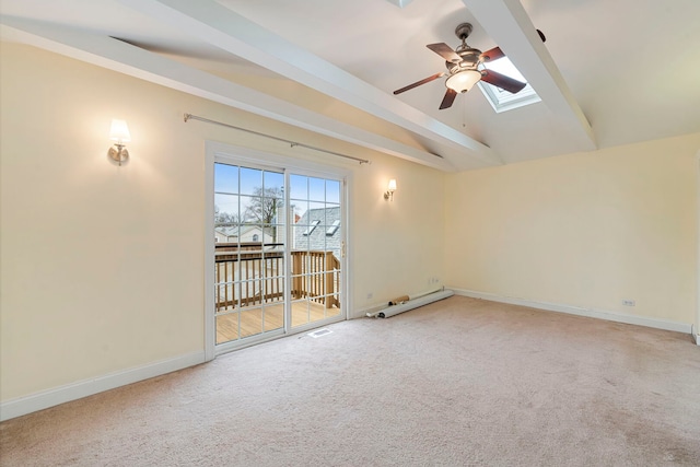 3022 N Hamilton Ave, Chicago, IL 60618 - spare room featuring vaulted ceiling with skylight, baseboards, a ceiling fan, and light colored carpet