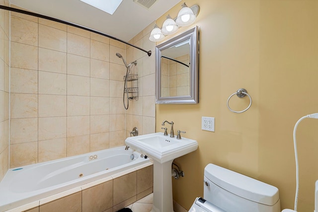3022 N Hamilton Ave, Chicago, IL 60618 - full bathroom featuring tiled shower / bath, visible vents, and toilet